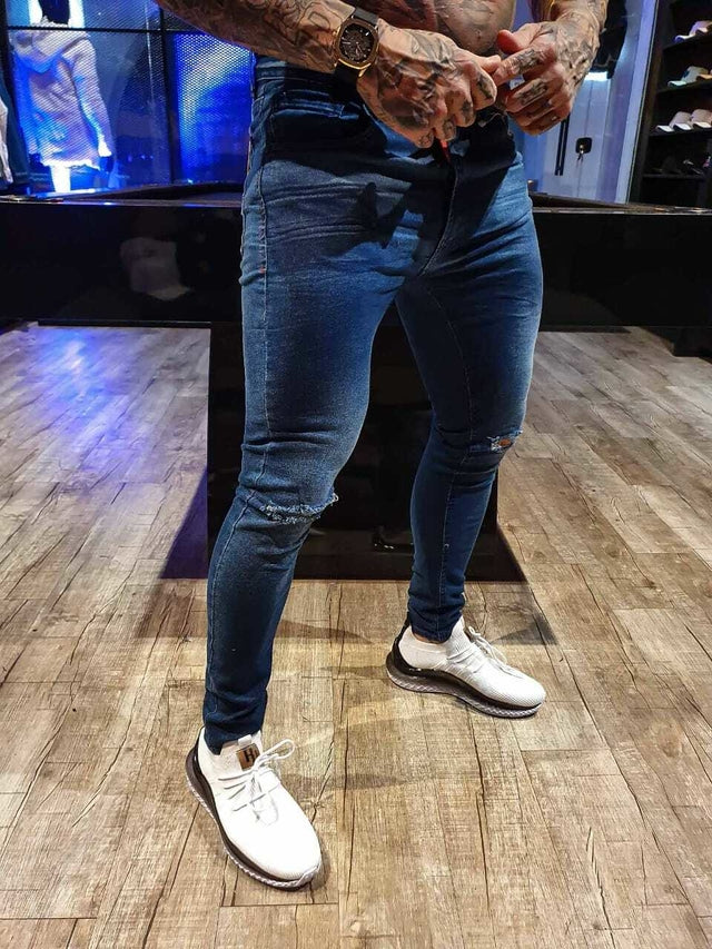 Calça Jeans Skinny Escura Rasgo No Joelho